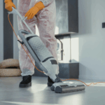 Professional cleaner using a vacuum cleaner